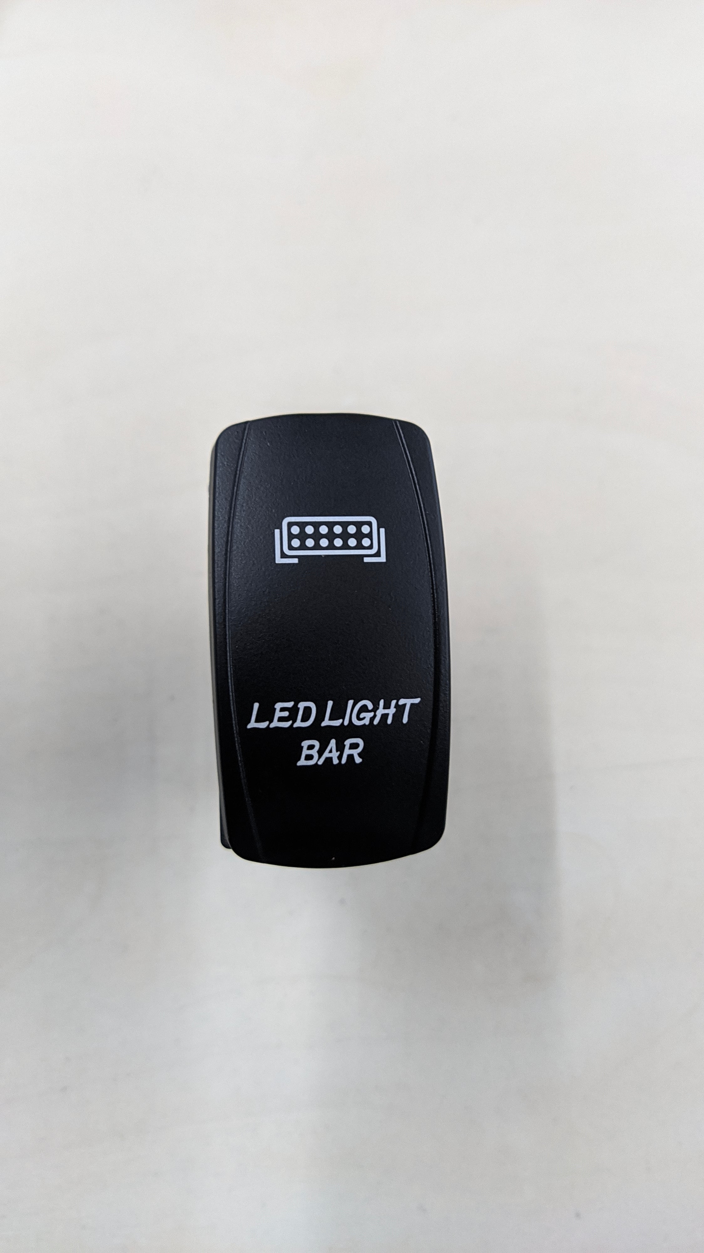 Jungiklis LED žibintams SU apšvietimu (rock switch)
